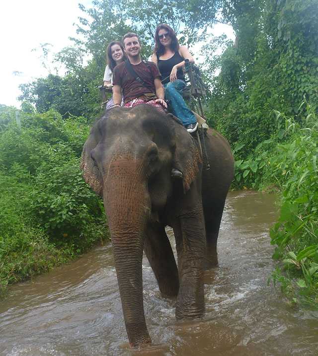 Riding an elephant in Thailand